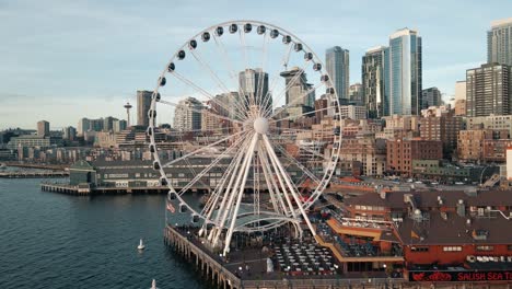 Drone-ascends-Seattle-ferris-wheel-pushing-past-ride-to-reveal-iconic-city-skyline