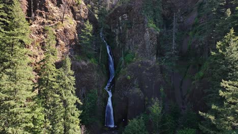 Aerial-Crane-Shot-of-Waterfall-in-Forest