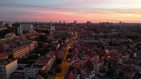 Aerial-City-Street-Hyperlapse-Brussels-Night,-Sunset-Evere-Neighborhood,-Skyline