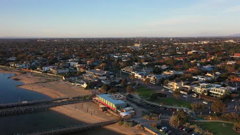 Aerial-video-flying-away-from-the-beach-of-Brighton-in-Melbourne,-Australia