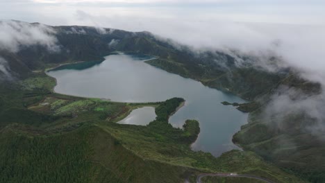Aerial-drone-shot-of-Lagoa-do-Fogo-in-Sao-Miguel-with-low-clouds