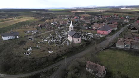 Aerial-shot-around-a-church-over-a-poor-village