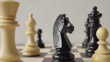 Closeup-of-chess-board-as-knight-takes-center-stage-in-captivating-rack-focus