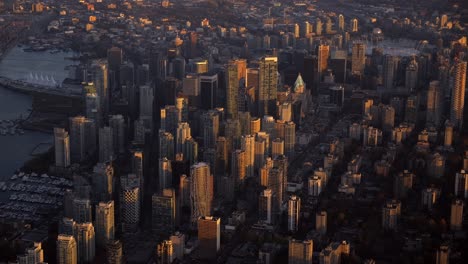 Golden-Hour-Aerial-View-of-Downtown-Vancouver-City,-Sunlit-Skyscrapers