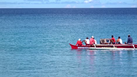 Fishermen-on-a-red-boat-looking-searching-for-fish