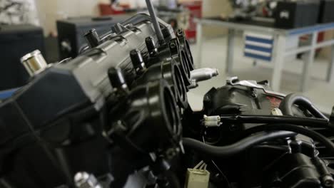 Close-Up-View-Of-Motorbike-Engine-Inside-Workshop