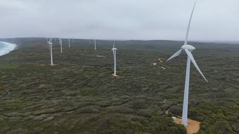 Drone-flying-away-from-Albany-wind-farm-on-cloudy-day