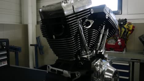 View-Of-Motorbike-Engine-Inside-Workshop.-Follow-Shot