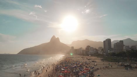 Beautiful-drone-footage-of-Sugarloaf-mountain-and-the-crowded-beach-in-Rio-de-Janeiro