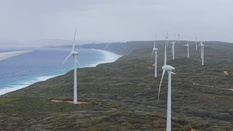 Cinematic-drone-flight-along-coastline-of-Albany-wind-farm
