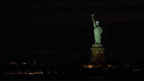 Statue-of-Liberty-and-Harbor-Lights-at-Night