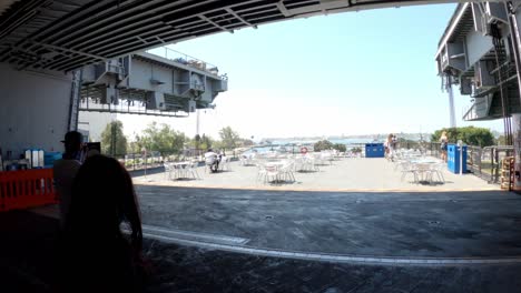 Tourists-entering-flight-deck-of-the-USS-Midway-Museum-in-downtown-San-Diego