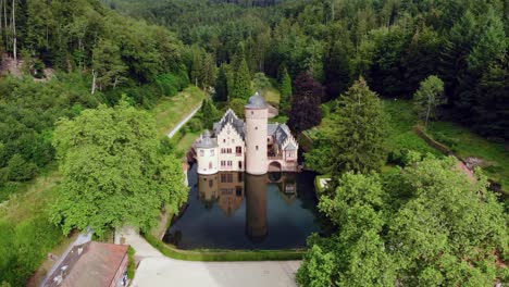 Aerial-Dolly-Out-of-Mespelbrunn-Castle-in-Germany