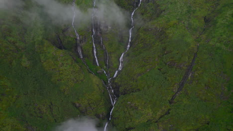 Adventurous-Landscape-with-waterfalls-covered-by-clouds,-Aerial-shot,-Rivers-Nepal-greenery-4K