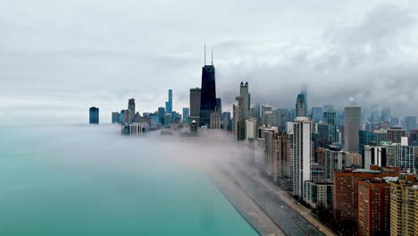 Aerial-view-circling-the-skyline-of-Streeterville,-foggy-day-in-Chicago,-USA