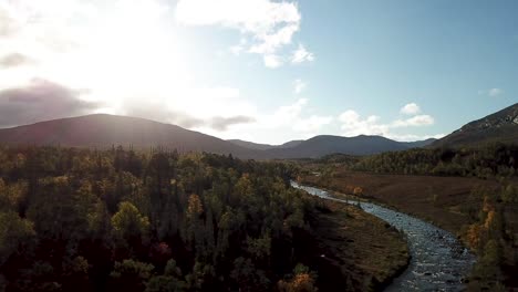 A-flight-over-the-autumnal-forest-and-getting-a-fine-view-of-the-Lunndörrsån-river-in-Vålådalen