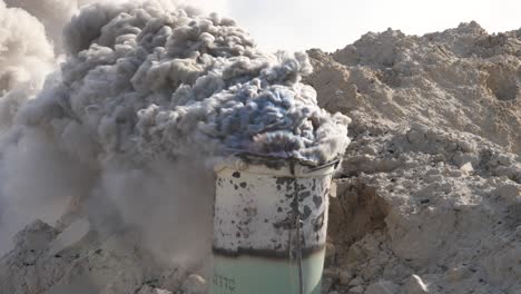 Smoke-from-burning-limestone-in-an-iron-barrel