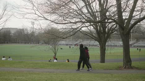 View-Of-Sports-Field-With-People-Exercising-During-Quarantine-Lockdown-In-Montreal
