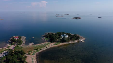 Aerial-view-around-a-villa-on-island-bay-in-Hanko-Finland---circling-drone-shot