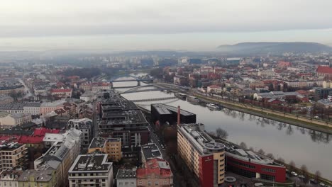 Vistula-River-new-bridge,-Krakow-modern-and-historic-buildings-urban-panorama