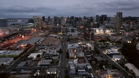 Push-Out-Drone-Shot-of-the-San-Diego-Skyline-at-Dusk-in-San-Diego,-California