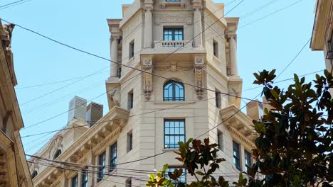 Close-up-view-of-the-top-of-the-Ariztía-Building-between-strung-cables-on-New-York-Street-in-Santiago-Chile