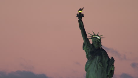 Close-up-of-Illuminated-Statue-of-Liberty-and-Pink-Sky