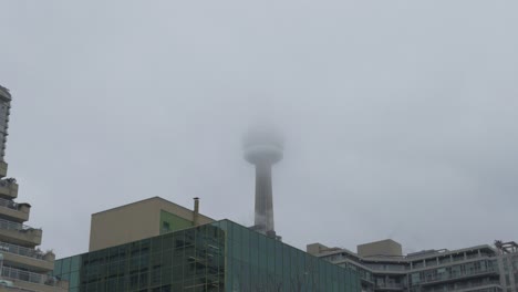 Clouds-Covering-CN-Tower-In-Toronto,-Canada