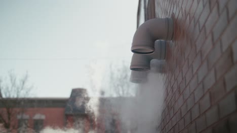 Steam-Coming-Out-Of-Vent-On-Side-Of-Building-During-Lockdown