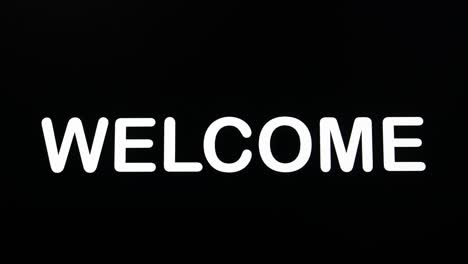 Typography-appearing-on-the-screen-on-a-black-background-with-the-word-welcome