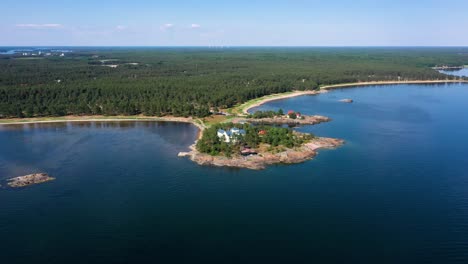 Aerial-view-around-a-villa-on-the-Stora-Tallholmen-island,-sunny-day,-in-Hanko,-Finland---orbit,-drone-shot