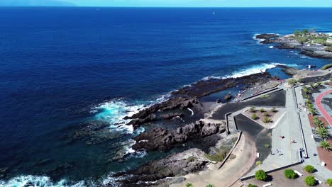 Beautiful-coast-of-tropical-calm-Tenerife,-Canary-island,-Spain,-aerial-natural-pool-formation