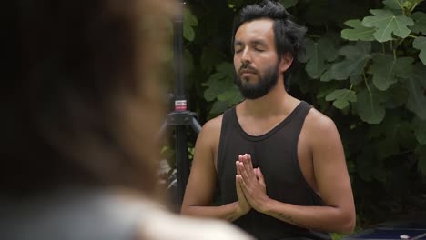 Yoga-Student-Closing-His-Eyes-Meditating-In-Nature,-Lima,-Peru