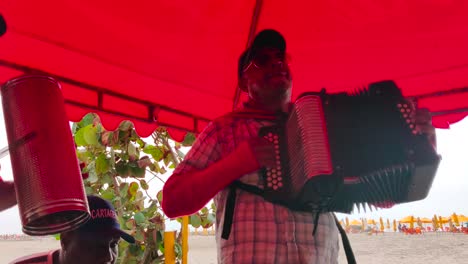 A-man-is-playing-the-accordion-and-another-is-playing-the-Gaucharaca