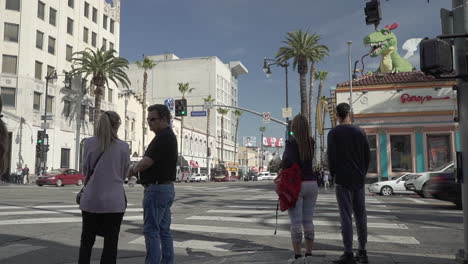 People-walking-across-the-street-on-Hollywood-Blvd