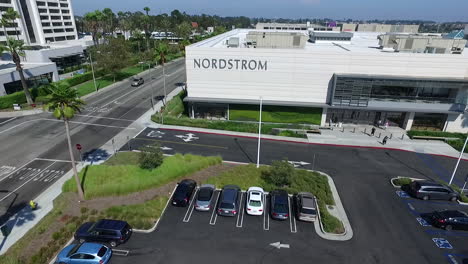 Aerial-Drone-flying-back-away-from-Del-Amo-Fashion-Center-parking-lot-and-businesses