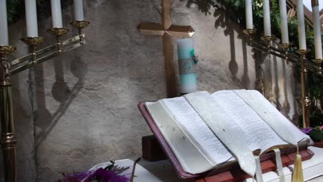 Interior-shot-of-candles-and-bible-placed-in-Wayfarers-Chapel-in-Los-Angeles,-a-popular-wedding-venue-and-Christian-church