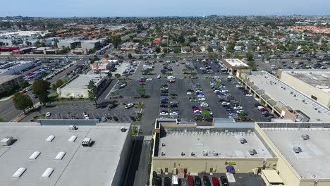Aerial-drone-flying-over-shopping-center-towards-corner-of-Torrance-Blvd,-and-Del-Amo-Blvd