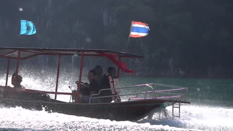 Thai-Long-Tail-Boat-Sailing-in-Tropical-Sea-on-Exotic-Phi-Phi-Island-Tour,-Cinematic-Slow-Motion