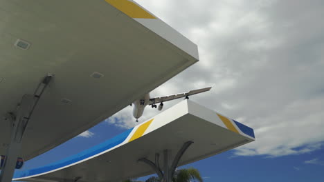 Slow-motion-shot-of-large-commercial-airplane-passing-overhead