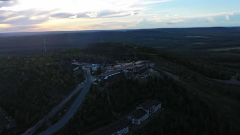 Aerial-view-of-rebuilding-of-the-burnt-Hotel-Iso-Syote,-in-Syote-national-park,-Finland---circling,-drone-shot
