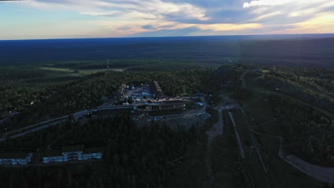 Aerial-view-of-the-burnt-Hotel-Iso-Syote-under-construction,-in-Pudasjarvi,-Finland---orbit,-drone-shot