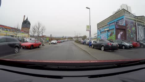 POV-shot-of-a-car-driving-in-the-outskirts-of-a-german-town