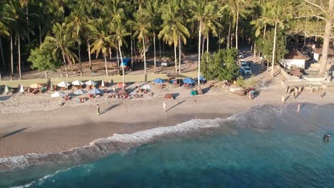 Aerial-View-Of-People-On-Beach-At-Crystal-Bay-On-Nusa-Penida-Island