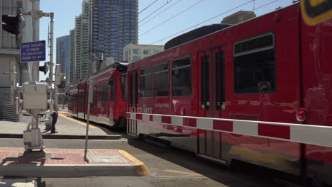 Slow-Motion-shot-of-trolley-leaving-Downtown-San-Diego