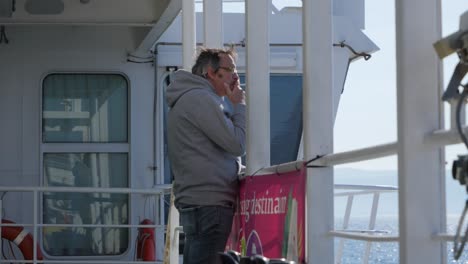 Man-smoke-cigarette-in-the-ferry