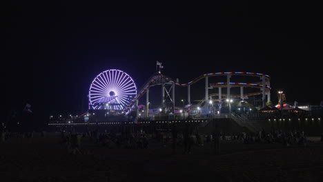 Timelapse-shot-of-Santa-Monica-pier's-Pacific-Park-with-Ferris-wheel-at-night