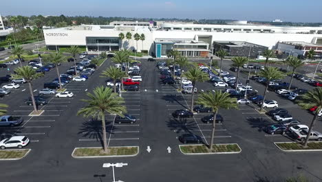 Aerial-Drone-slowly-flying-across-Del-Amo-Fashion-Center-parking-lot-and-shops
