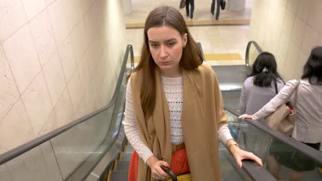 Woman-on-the-escalators-of-the-subway