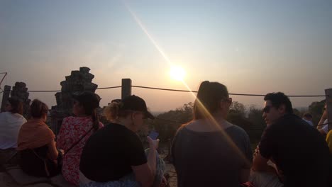 People-gathered-at-the-highest-part-of-a-temple-waiting-for-the-sun-to-set